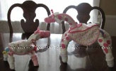 animals made out of rolled diapers and decorated with baby items