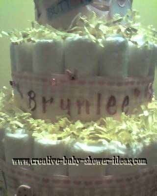 closeup of doll diaper cake showing Brynlee letters