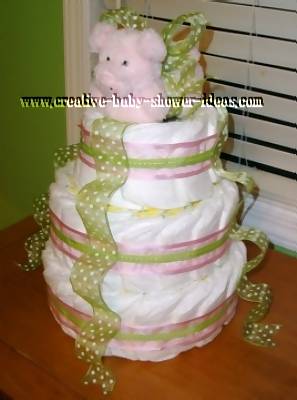 side view of girl pig diaper cake
