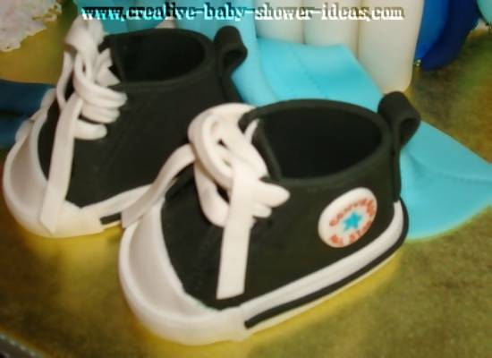 black baby sneakers with juicy diaper bag cake
