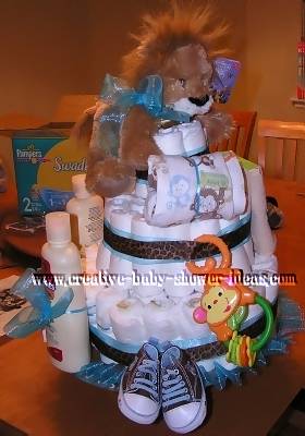 other side of lion diaper cake showing baby sneakers