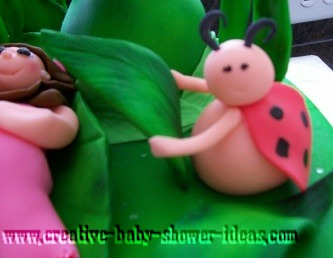 closeup of ladybugs on pampered mommy baby shower cake