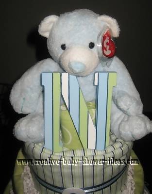 closeup of teddy bear and letter N on diaper cake
