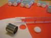 Adding wheels to train cars, also cut out slightly smaller circles in dark blue for wheel centers. 