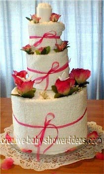 white and pink towel cake