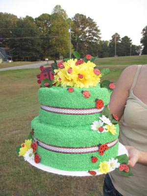 green and red ladybug towel cakes