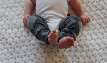 a 3 month old baby wearing finished infant baby leg warmers