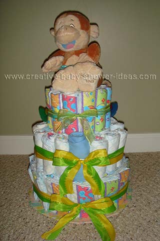 front of giggling monkey diaper cake