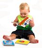 baby boy reading colorful books