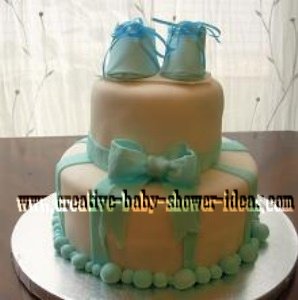 blue and white bootie baby cake