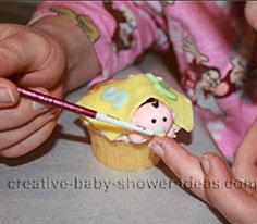 baby cup cake painting the baby pacifier for the shower cupcakes