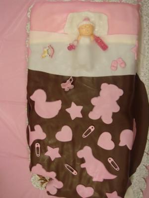 baby blanket cake baby sleeping on pink and brown baby shower cake