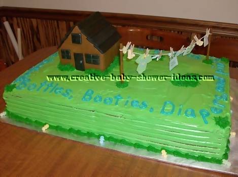 baby clothesline and log house cake