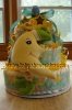 yellow and green diaper cake with stuffed moon toy and printed star ribbon