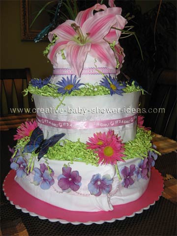 blue buttefly diaper cake with daisies and lilies