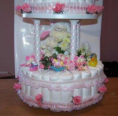 closeup of white lamb on diaper cake
