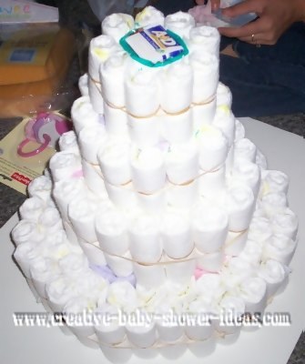 4 tier diaper cake being made