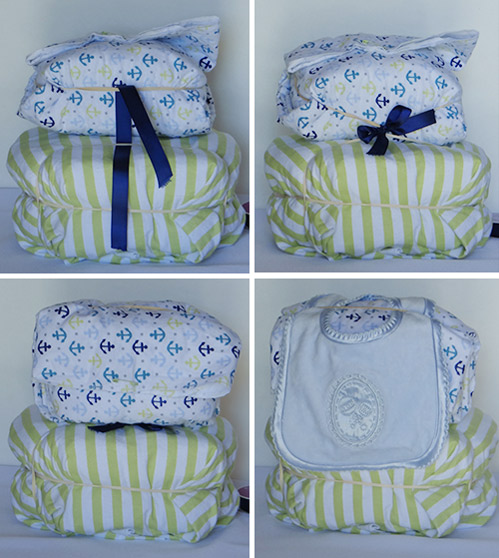 blue and green diaper baby carriage with whales and stripes attaching pillow to diaper stroller