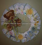 diaper wreath decorated with brown bear and flowers