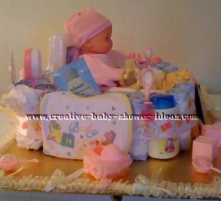 baby doll in basket diaper cake