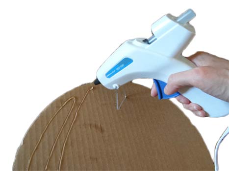 glueing the cake circles together to make a cupcake stand
