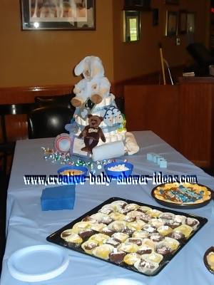 bear diaper cake on baby shower table