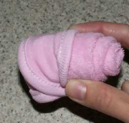 roll the washcloth edges up 