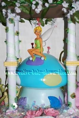 closeup of tinkerbell diaper cake sitting on mushroom bank